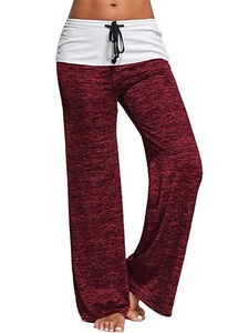Detail of wide-leg yoga pants featuring dark red heather texture and drawstring waist