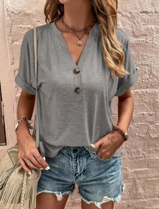 Detail of grey V-neck short sleeve knit top with buttons and cuffed sleeves