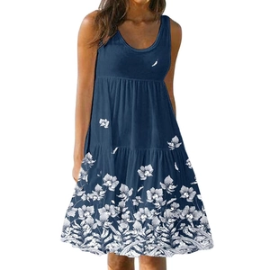 Detail of blue sleeveless dress featuring tiered skirt and elegant white floral print