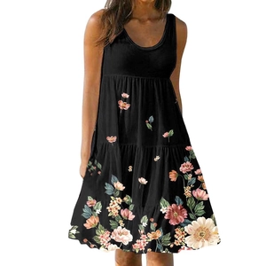 Close-up of vintage floral print and tiered ruffle hem on a black sleeveless summer dress