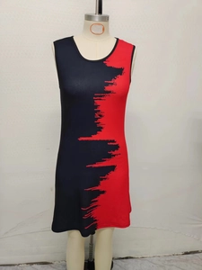 Detail of red and black sleeveless dress featuring unique jagged abstract print pattern