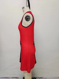 Detail view of red sleeveless slim fit dress with black artistic graffiti pattern on the side