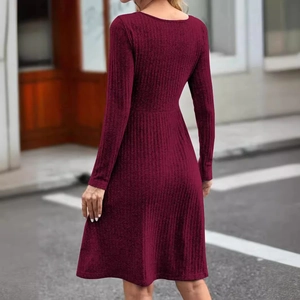 Burgundy ribbed knit long sleeve dress with A-line skirt shown in street style view