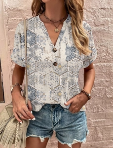 Detail of V-neck buttoned short sleeve top with blue geometric mandala floral print