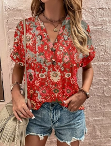 Detail view of red floral printed V-neck blouse with button closure and bohemian pattern