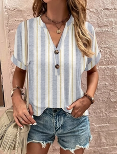 Detail of V-neck stripe top with wooden buttons and blue polka dot patterns