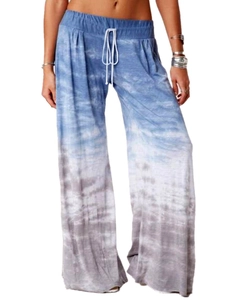 Detail of bohemian gradient tie-dye wide-leg trousers with drawstring elastic waistband