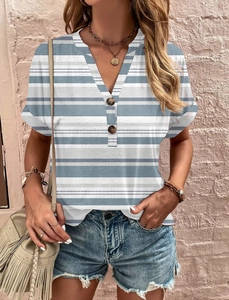 Close-up of V-neck blue and white striped top with wooden button detail and herringbone print