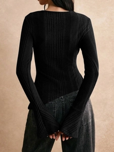 Detail of ribbed knit long sleeve top back with split cuffs and slim fit silhouette