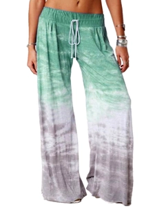 Detail of wide-leg yoga pants with green gradient tie-dye and white drawstring waist