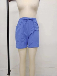 Detail of royal blue linen shorts showing elastic drawstring waist and large side pockets