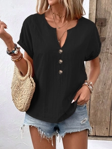 Detail of a black V-neck t-shirt with wooden buttons and rolled-up sleeves for summer