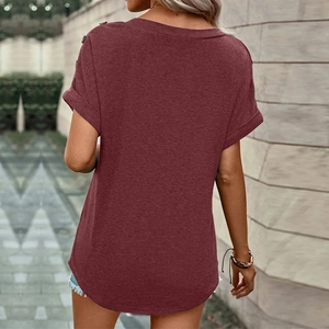 Detail view of burgundy short sleeve T-shirt with button accents and curved hem