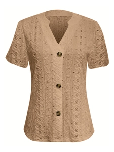 Detailed view of camel V-neck shirt featuring eyelet lace fabric and amber buttons