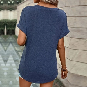 Detail of navy blue t-shirt back with button accents on shoulders and a curved hem