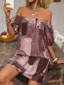 Detail of off-shoulder mini dress featuring purple geometric patterns and lantern sleeves