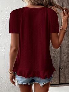 Detail of wine red eyelet embroidered t-shirt back with stylish ruffle hem