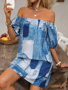 Detail view of off-shoulder neckline and lantern sleeves on printed bohemian dress