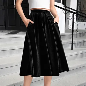 Women's black velvet A-line skirt with high elastic waist and functional side pockets