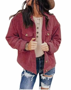 Detail of wine red corduroy jacket featuring dual chest pockets and retro metal buttons