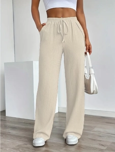 Women's loose wide-leg lounge pants with waffle texture and adjustable drawstring waist