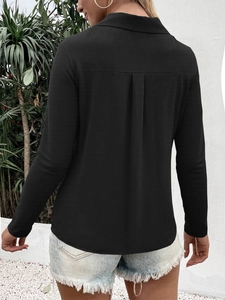 Detail of elegant black ice silk shirt back showing inverted pleat for loose fit