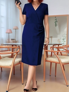 Detail of elegant navy blue V-neck wrap dress featuring short sleeves and pleated waistline