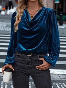 Detail of dark teal velvet cowl neck top featuring elegant gathered lantern sleeve cuffs