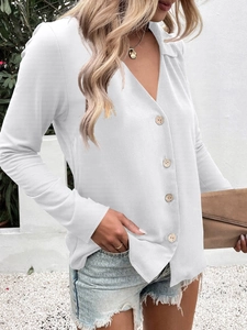 Detail of elegant white long sleeve ice silk shirt featuring V-neck and decorative wood buttons