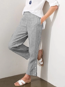 Detailed view of grey striped cotton linen pants with side buttons and functional pockets