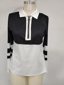 Close-up of contrast polo collar with silver ring zipper and striped long sleeves