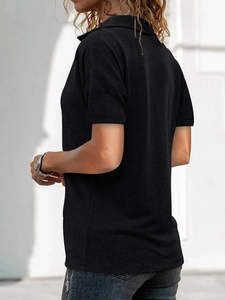 Side view of black knit polo shirt featuring a classic collar and casual fit for women
