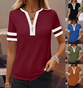 Detail of V-neck top featuring metal zipper closure and striped short sleeves in multi-colors