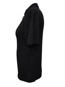 Detail view of black knit top featuring a side profile with a polo collar and metal zipper