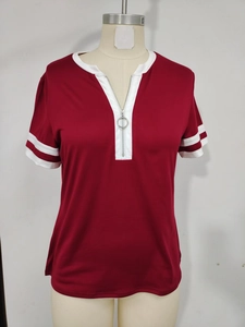 Detail of burgundy V-neck t-shirt featuring a metal zipper pull and white striped sleeves