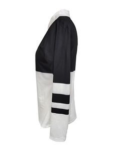 Detail view of the black and white color-block sweatshirt with striped sleeve accents