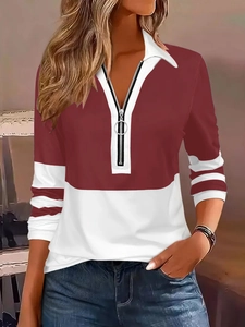 Detail of burgundy color-block long sleeve polo shirt with white collar and ring zipper