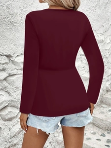 Rear view of a slim fit deep wine red long sleeve top with casual light blue denim shorts