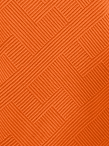 Vue macro d'un tissu tricoté orange montrant la texture détaillée du tissage géométrique