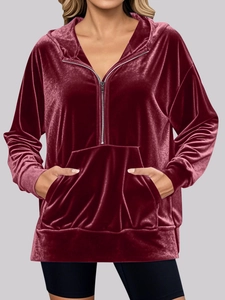 Women's burgundy velvet hoodie with half-zip design and front kangaroo pocket