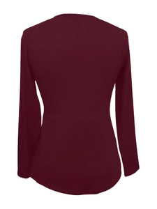 Detail view of wine red long sleeve top featuring a slim fit waist and high-quality knit texture