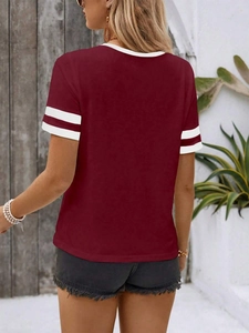Back view of burgundy knit t-shirt with white round neck and striped sleeves