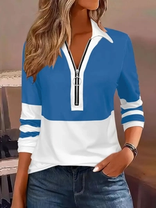 Detail of silver zipper closure and round ring pull on long sleeve polo shirt