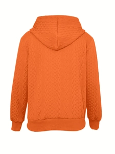 Back view of orange cable knit hoodie with long sleeves and ribbed cuffs in soft knit