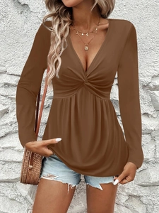 Detail view of brown V-neck top with stylish front knot design for women's fashion