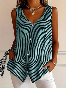 Close-up of blue tiger print sleeveless shirt with deep V-neck and white buttons detail