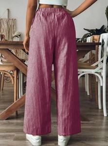 Rear view of striped high-waist wide-leg pants showing the smooth drape and elastic waist