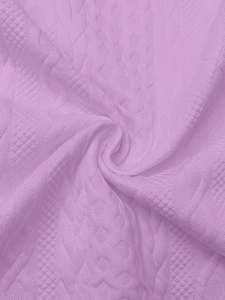 Detailed close-up of lavender knitted fabric with cable and diamond stitch patterns