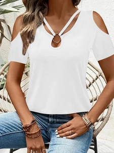 Detail of white cold-shoulder T-shirt with gold ring and criss-cross v-neckline