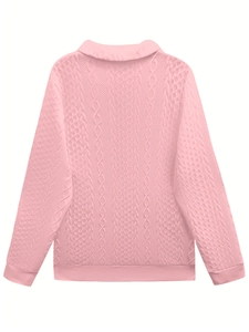 Detailed back view of a pink cable-knit sweater with a polo collar and ribbed cuffs